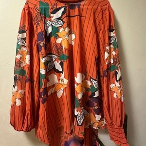 Dress shirt tie in front of floral pattern